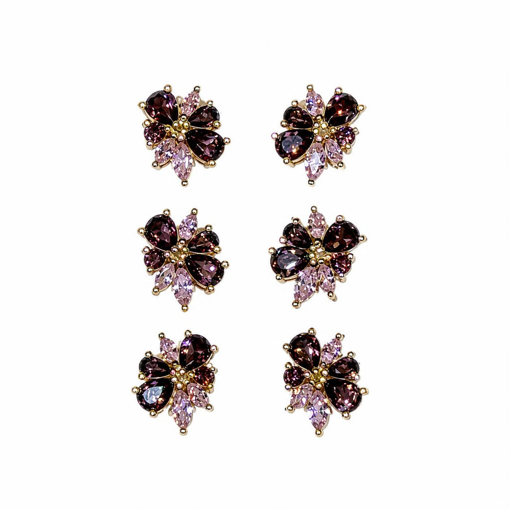 Elegante blomsterøreringe med lilla sten